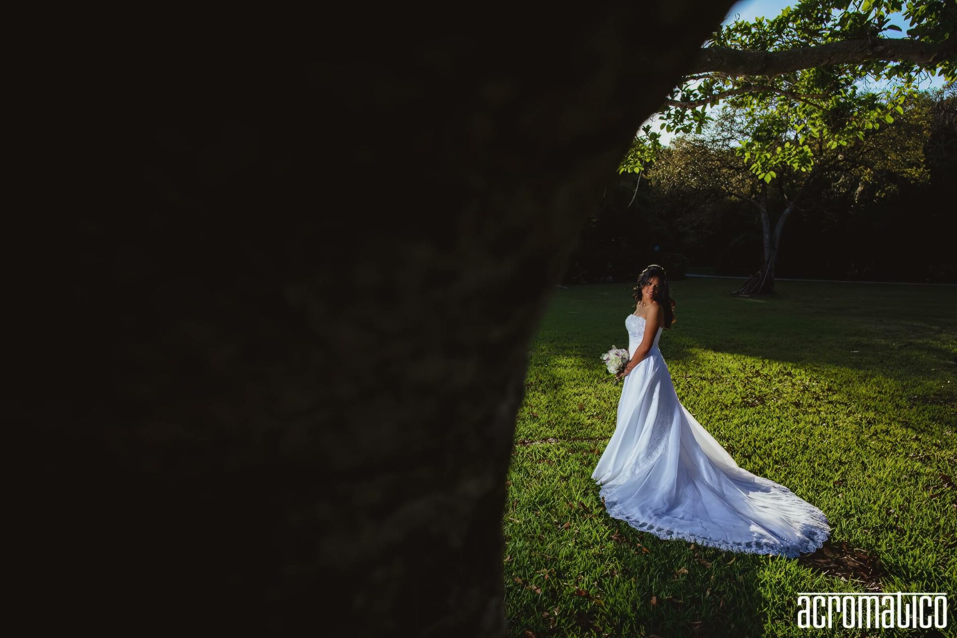 Claire wearing her original strapless wedding dress 20 years later at Matheson Hammock